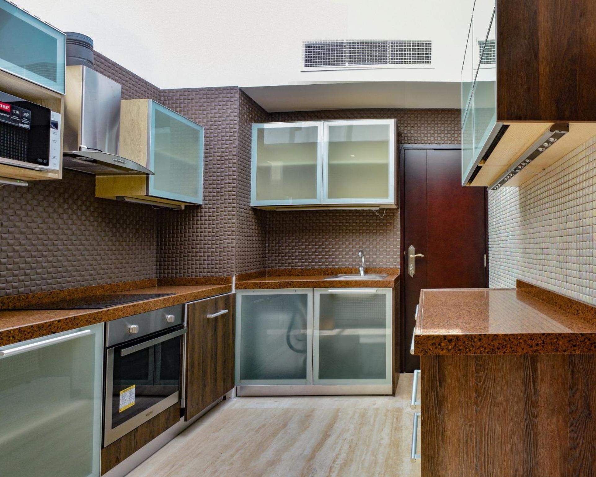 รีฟ รีสอร์ต Hotel มานามา ภายนอก รูปภาพ A modern kitchen