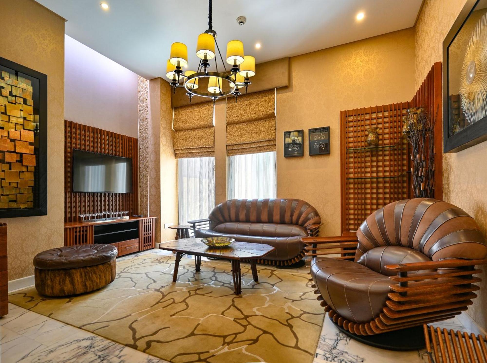 รีฟ รีสอร์ต Hotel มานามา ภายนอก รูปภาพ A living room in a house